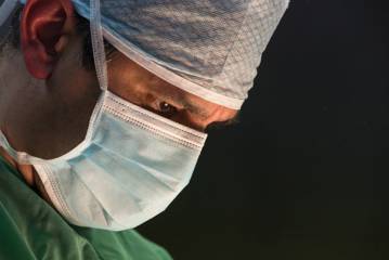 Dr Ioannis Liapakis focused during a delicate surgical operation