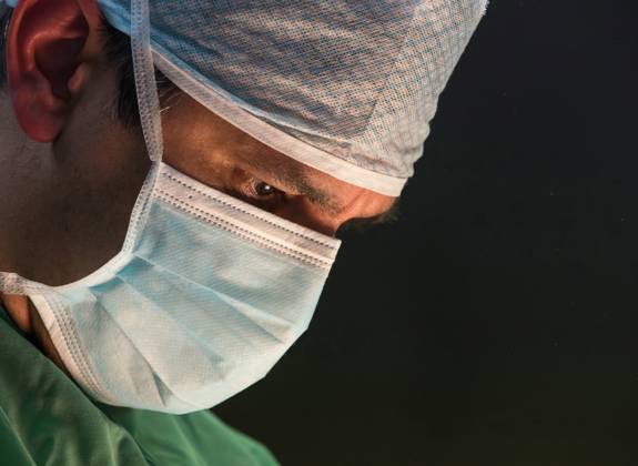 Dr Ioannis Liapakis focused during a delicate surgical operation