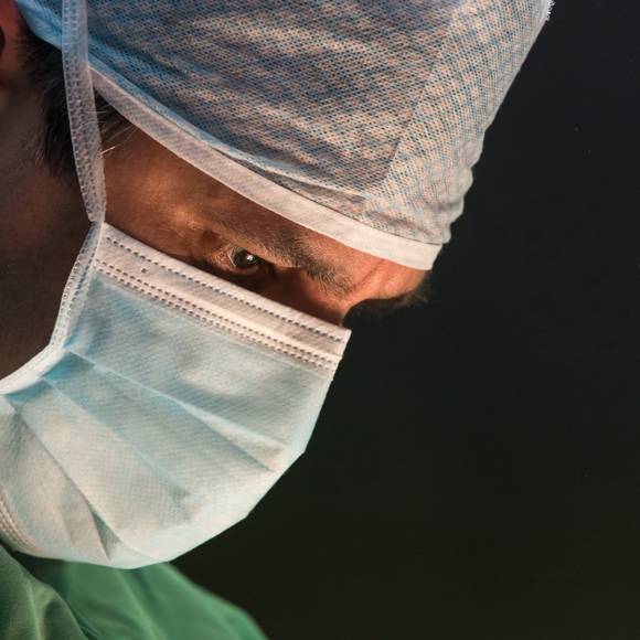 Dr Ioannis Liapakis focused during a delicate surgical operation