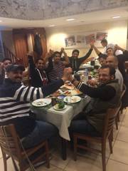 Volunteer doctors celebrating together after a successful medical mission