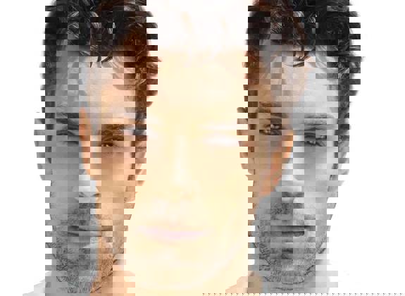 Portrait of a man with restored full hair transplantation procedure