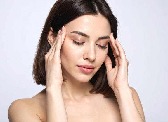 Portrait of relaxed and confident woman after receiving Botulinum toxin treatment