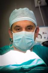 Dr Ioannis Liapakis focused during a surgical procedure in the operating room